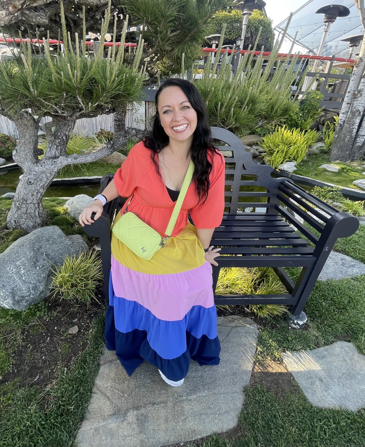 Amanda in a bright orange and yellow dress